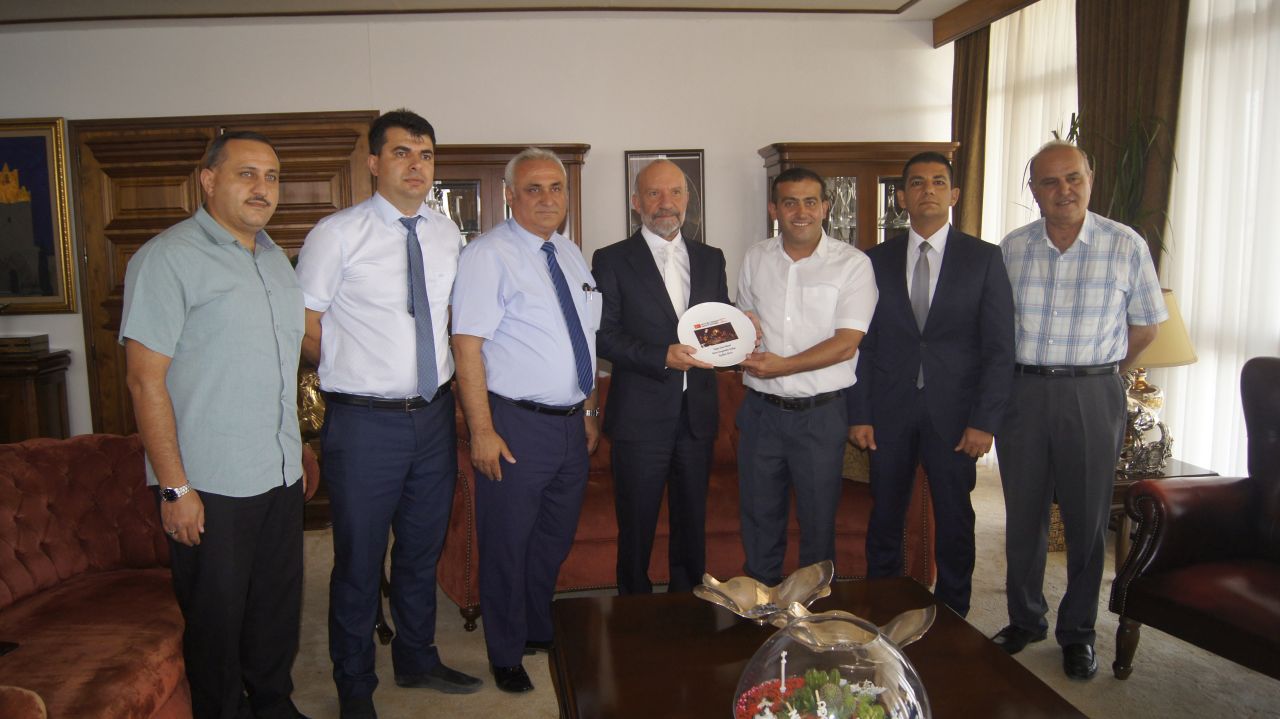 TRNC National Will Platform Association for Assistance and Solidarity presented a plaque to the Near East University Founding Rector Dr. Suat İ. GÜNSEL